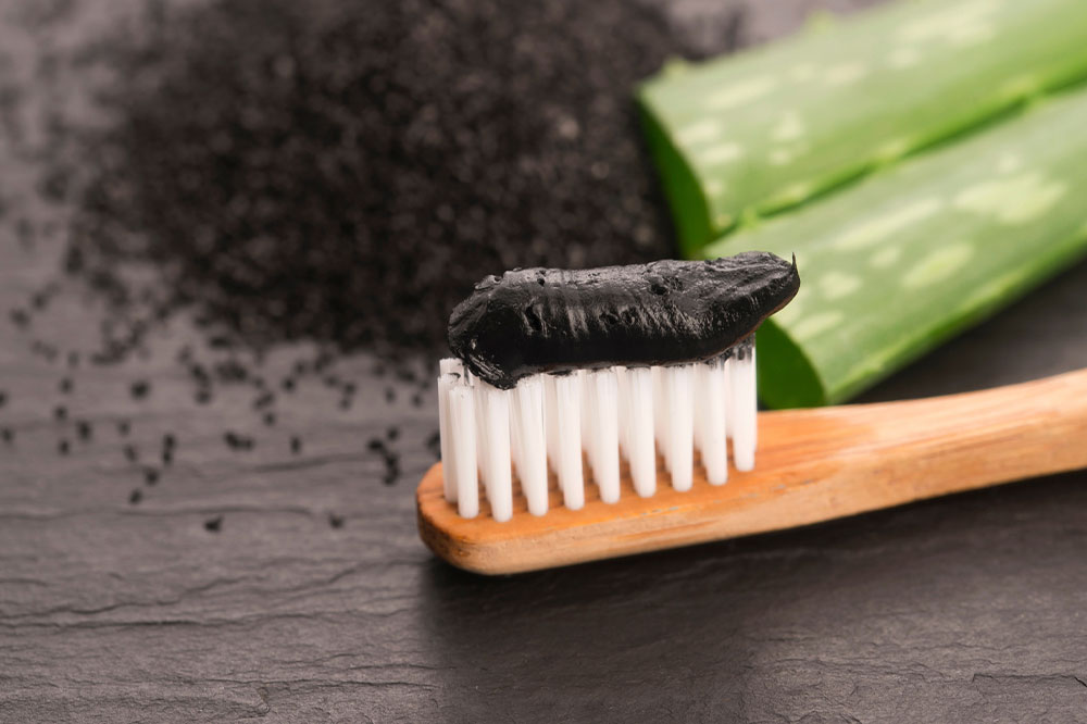 Consider these pros and cons before using charcoal toothpaste